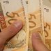 Brasileiros retiram R$ 718,7 milhões da poupança em maio